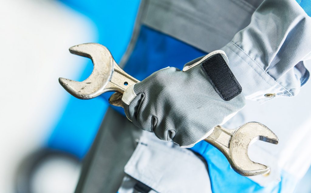 Mechanic with Large Wrench